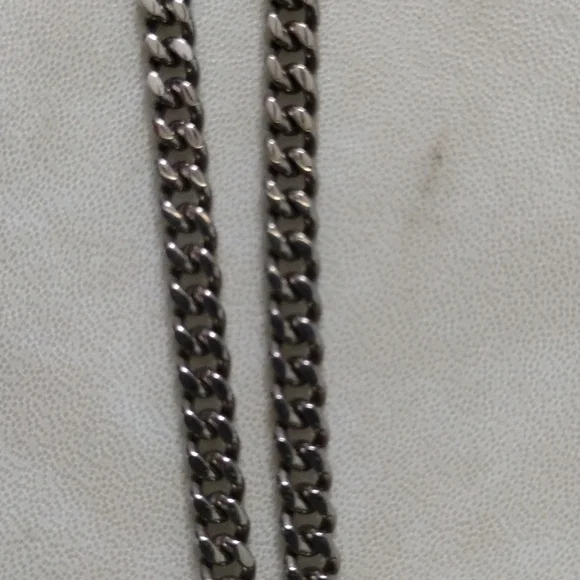 Chisel stainless steel skull pendant and chain necklace.